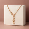 Woman wearing star-shaped rose gold necklace – festive jewellery