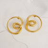 Front view of gold-plated bold spiral hoop earrings – TrioShine statement jewelry