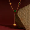 Close-up of gold heart and green stone Y-shaped necklace – fashion jewelry for women