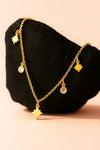 Close-up of gold plated star charm necklace with sparkling cubic zirconia, stylish women’s jewelry